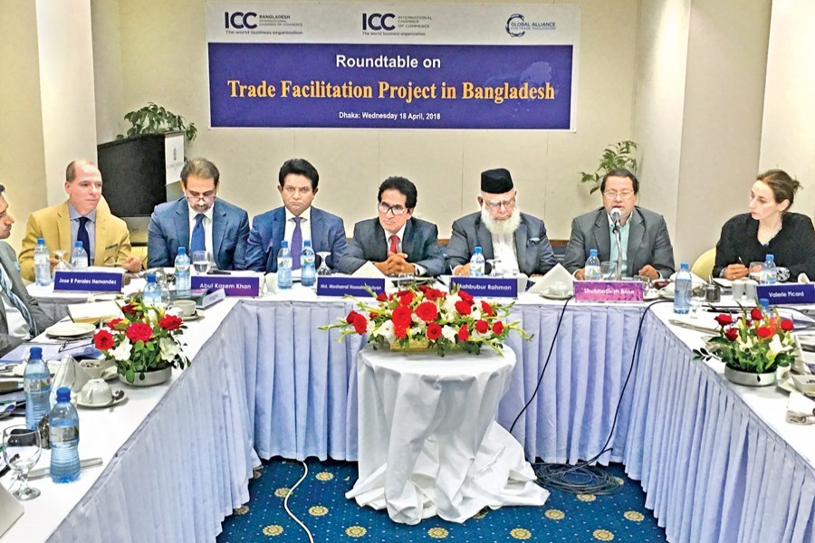 Md. Mosharraf Hossain Bhuiyan, Chairman, National Board of Revenue (4th from right); Shubhashish Bose, Secretary, Ministry of Commerce (2nd from right); ICC Bangladesh President Mahbubur Rahman (3rd from right); ICCB Executive Board Member A.K. Azad (3rd from left); DCCI President Abul Kasem Khan (2nd from left); Jose R Perales Hernandez, Deputy Director - Global Alliance for Trade Facilitation, Washington (extreme left), and Valerie Claire Picard, Deputy Director - Global Alliance for Trade Facilitation, ICC Paris, attending at the Roundtable on Trade Facilitation in Dhaka on Wednesday
