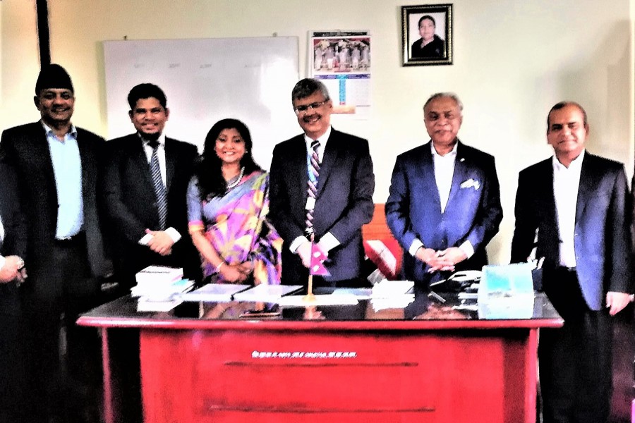 Luna Shamsuddoha, Chairman, Dohatec New Media, posing with Madhu Prasad Regmi,Secretary, Office of the Prime Minister and Council of Ministers, Public Procurement Monitoring Office, Government of Nepal, on Thursday at the contract signing ceremony