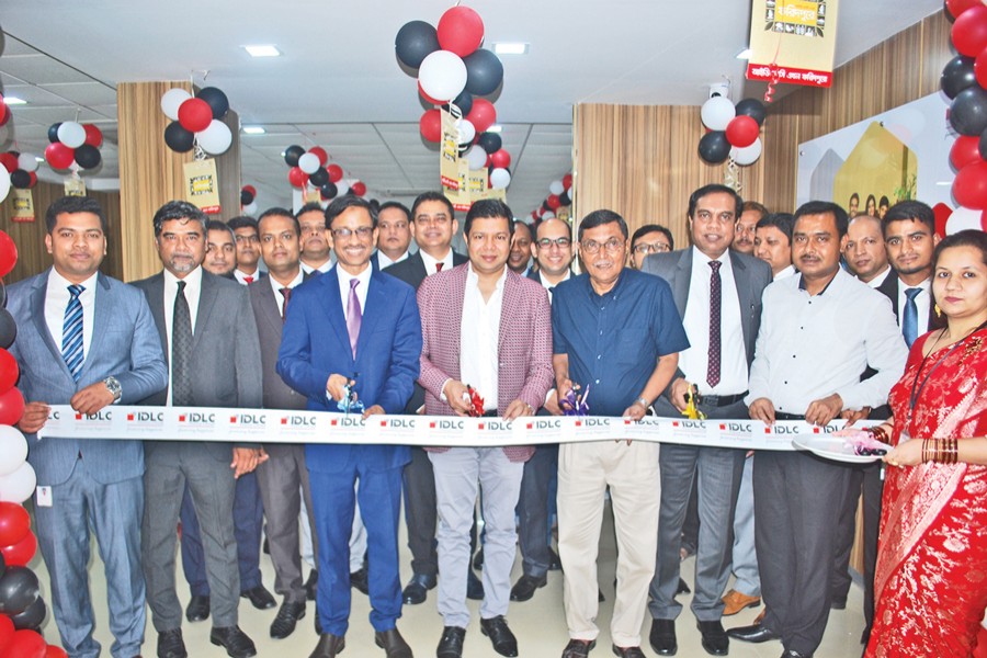 Aziz Al Mahmood, Chairman of IDLC Finance Limited, inaugurating the 39th branch of the company as the chief guest in Faridpur on Sunday while Arif Khan, CEO and Managing Director of the company was present