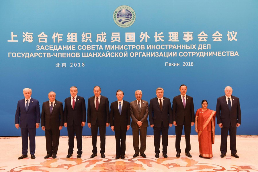 Foreign ministers and officials of the Shanghai Cooperation Organisation (SCO) posing for a group photograph before a meeting at the Diaoyutai State Guest House in Beijing, China on Tuesday	— Reuters
