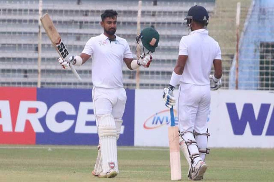 East Zone's batsman Liton Das celebrating after hitting a century against Central Zone on Day 2 of their Bangladesh Cricket League (BCL) match at the Shahid Kamruzzaman Stadium in Rajshahi on Wednesday — bdnews24.com