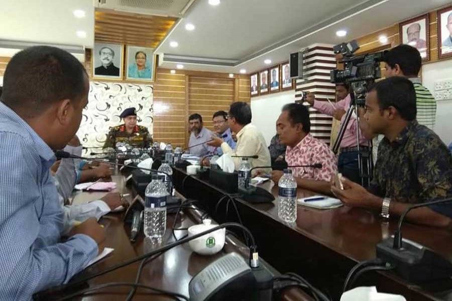 Director General of Immigration and Passports department Maj Gen Md Masud Rezwan talking to journalists at his office on Thursday