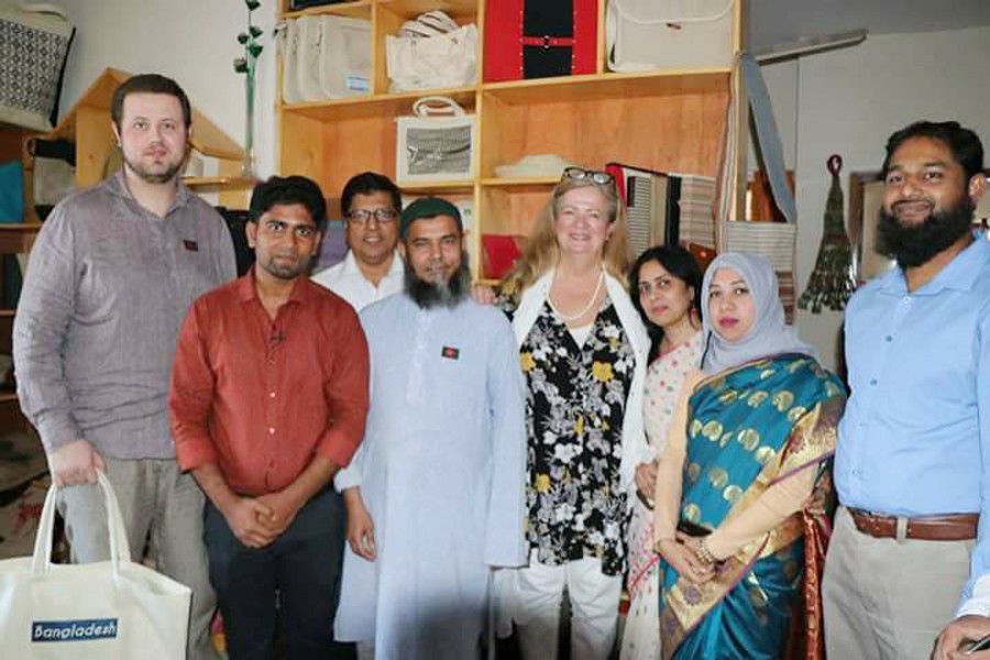 Christina Östergren (fouth from right), her son Gabriel Östergren (extreme left), Ibrahim Khalil on Christina's left and  Md Abdullah Al Hasan on extreme right seen with others during Christina's visit to AJAD office at Mohammadpur in the city.