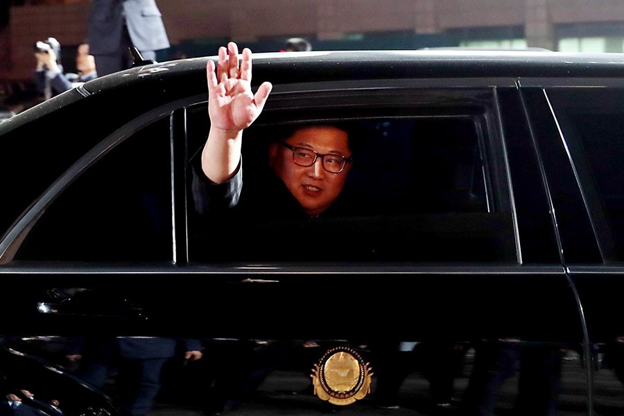 North Korean leader Kim Jong Un (inside a vehicle) bids farewell to South Korean President Moon Jae-in as he leaves after a farewell ceremony at the truce village of Panmunjom inside the demilitarised zone separating the two Koreas on Friday. -Reuters Photo