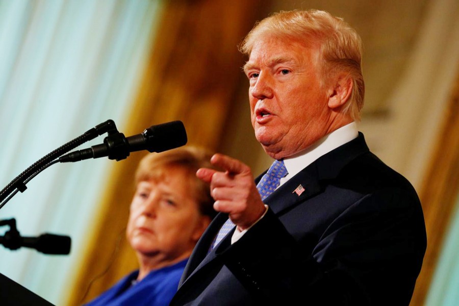 US President Donald Trump and Germany's Chancellor Angela Merkel holding a joint news conference in the East Room of the White House in Washington, US, on Friday    	— Reuters