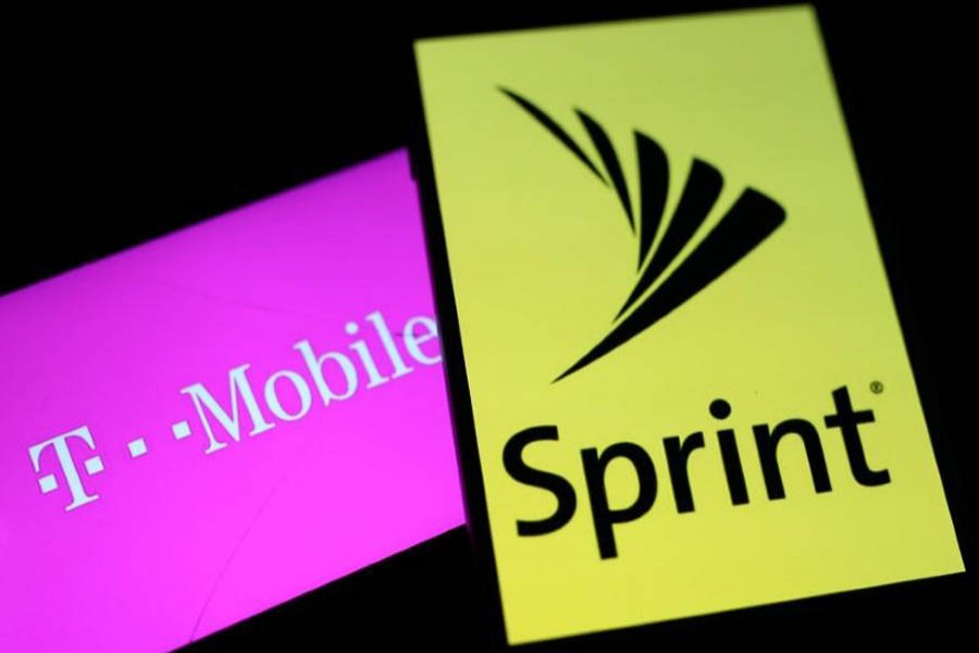 Smartphones with the logos of T-Mobile and Sprint are seen in this illustration taken September 19, 2017. Reuters/File