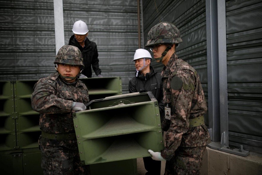 South Korean soldiers dismantle loudspeakers that were set up for propaganda broadcasts near the demilitarised zone separating the two Koreas in Paju, South Korea, May 1, 2018. Reuters