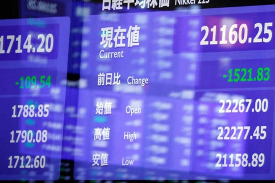 An electronic board showing the Nikkei share average is seen as market prices are reflected in a glass window at the Tokyo Stock Exchange (TSE) in Tokyo, Japan, February 6, 2018. Reuters/Files
