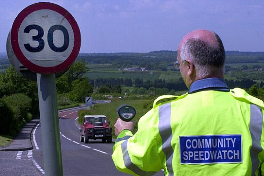 Volunteer with speed gun on UK street. Photo: Daily Mail