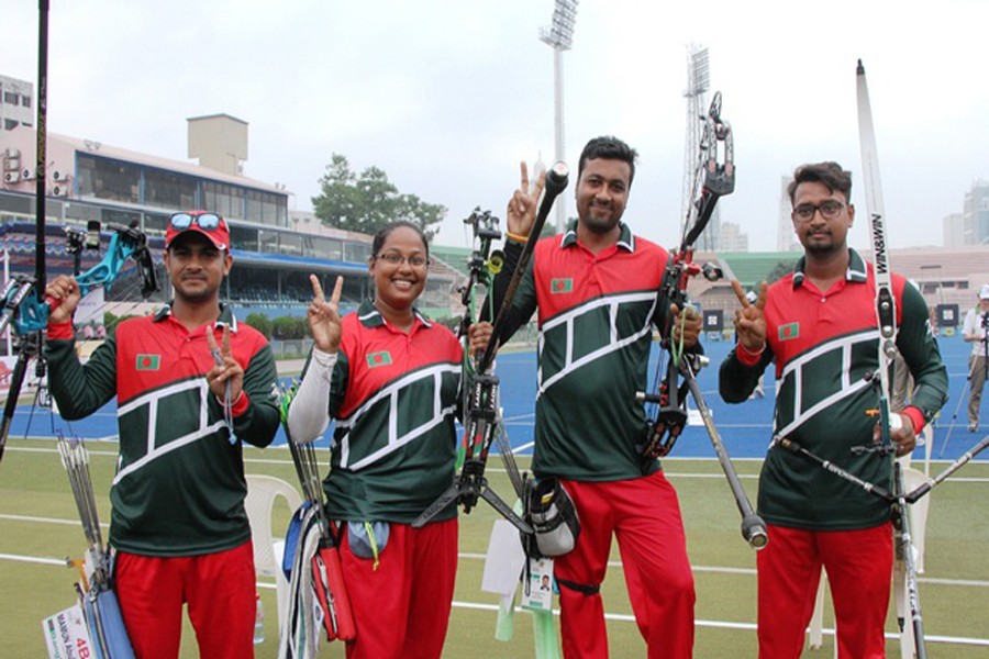 Abul Kashem Mamun, Roxana Akter, Ashim Kumar and Rumman Sana posing after reaching the final of the four-day 2nd ISSF International Archery Championship at the Maulana Bhashani National Stadium in the city on Tuesday	— bdnews24.com