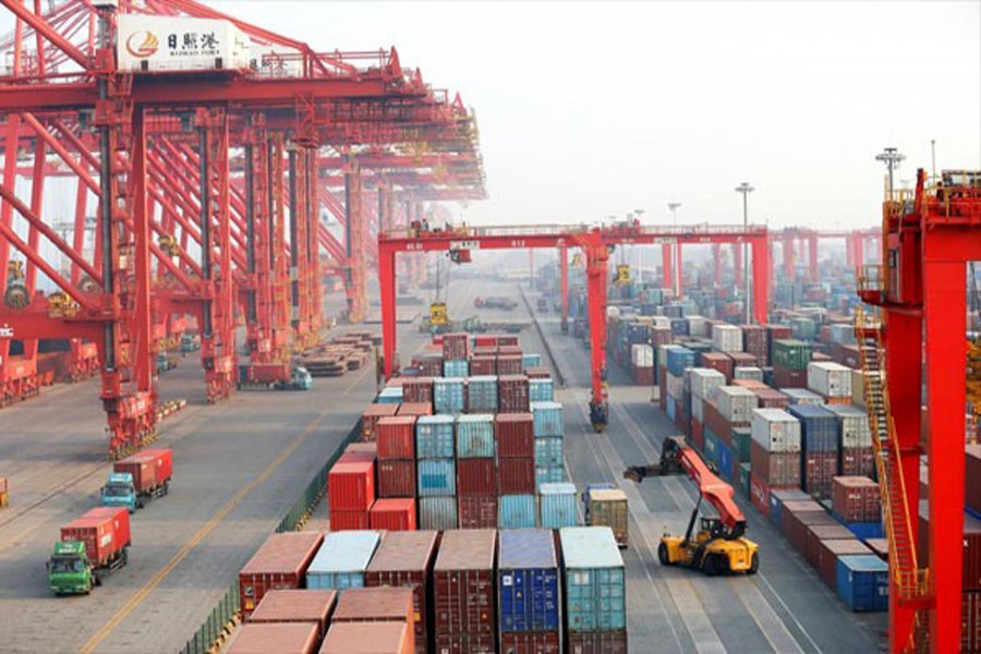 Containers and trucks are seen on the dock at Rizhao Port in Rizhao, Shandong province, China  	— Reuters
