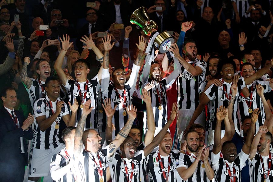 Juventus celebrate winning the Coppa Italia for the fourth year in succession following their emphatic victory over AC Milan on Wednesday - Reuters photo