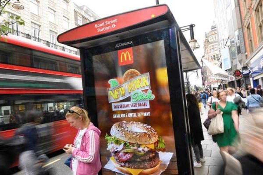 An electronic advertisement for a McDonalds food is seen at a bus stop on Oxford Street in London, Britain, May 11. Reuters/File