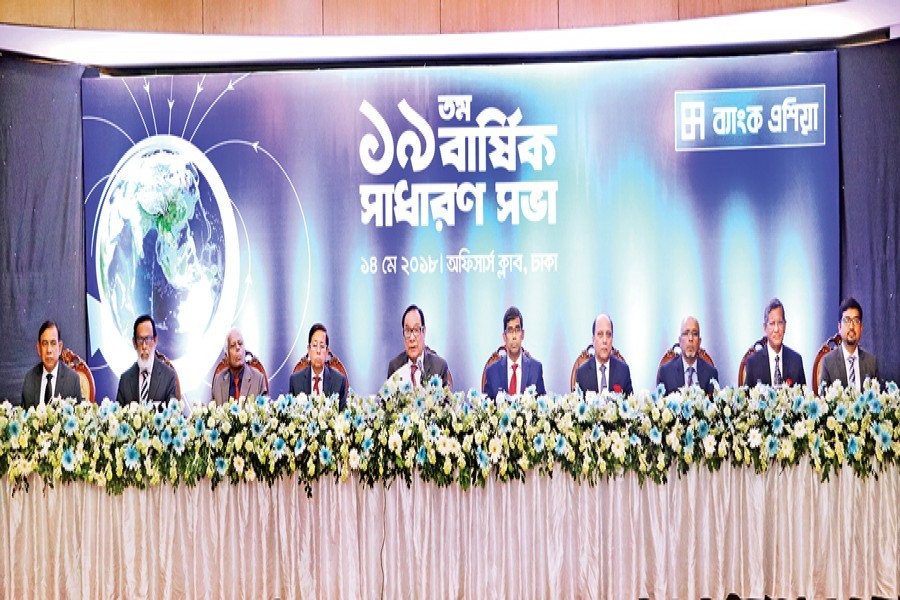 Chairman of Bank Asia A. Rouf Chowdhury presiding over the 19th annual general meeting of the bank at the Dhaka Officers Club in the city on Monday