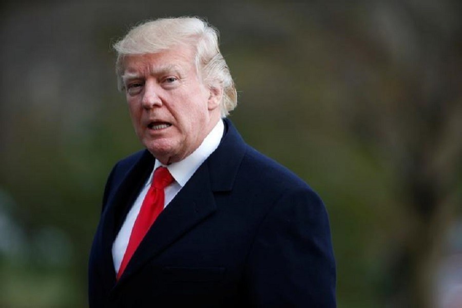 US President Donald Trump walks from Marine One upon his return to the White House in Washington, US, March 19, 2017. Reuters/Files