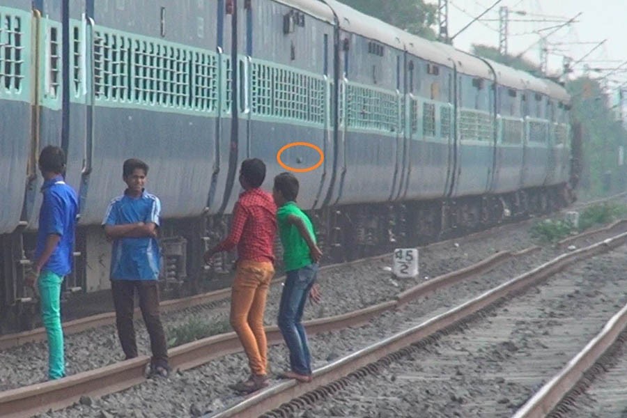 Preventing throwing of stones at running trains   