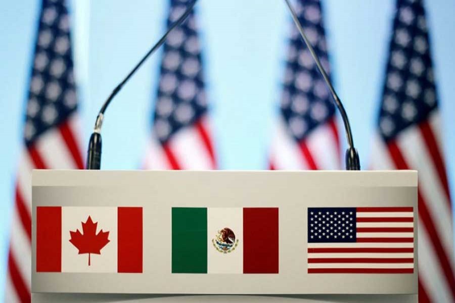 The flags of Canada, Mexico and the US are seen on a lectern before a joint news conference on the closing of the seventh round of NAFTA talks in Mexico City, Mexico, March 5, 2018. Reuters/File Photo