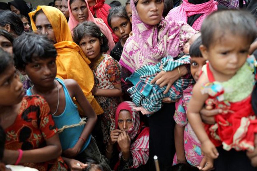 Amnesty says there were many children among the Hindus killed. Nearly 700,000 Rohingya, many of them women and children, have fled to Bangladesh since August. Reuters/File