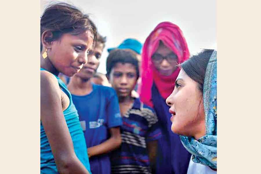 UNICEF goodwill ambassador Priyanka talking with Rohingya children on Wednesday — FE Photo