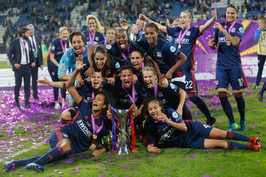 Lyon and team members celebrating with the trophy after winning the Champions League final on Thursday	— Reuters