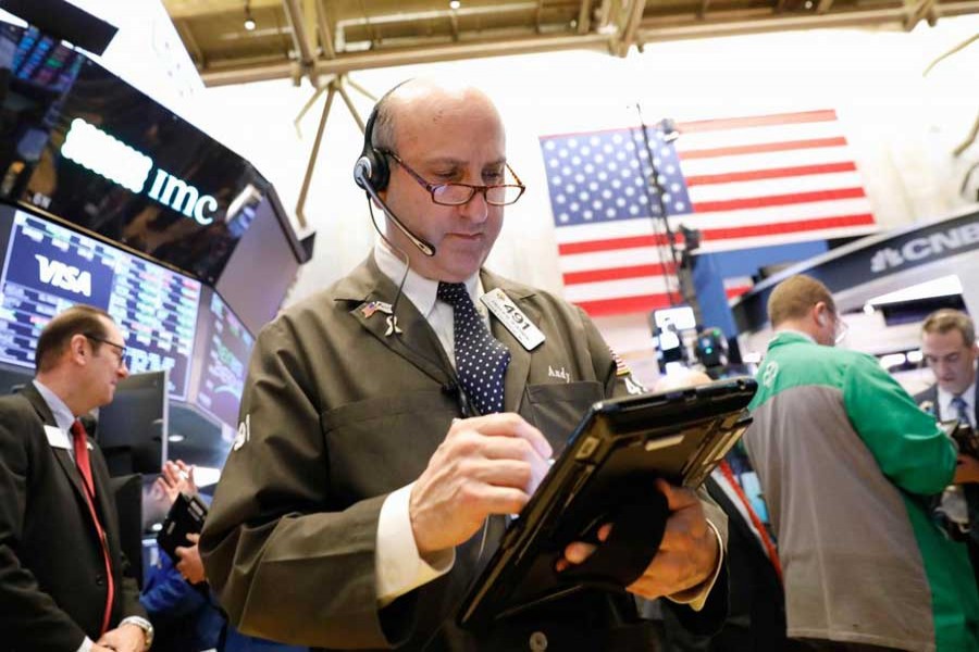 Traders work on the floor of the New York Stock Exchange (NYSE) in New York, US, May 22, 2018. Reuters