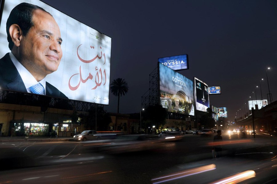 A Cairo street sign showing Egypt’s President Abdel Fattah al-Sisi ahead of the presidential election, March 25, 2018. Reuters file photo.