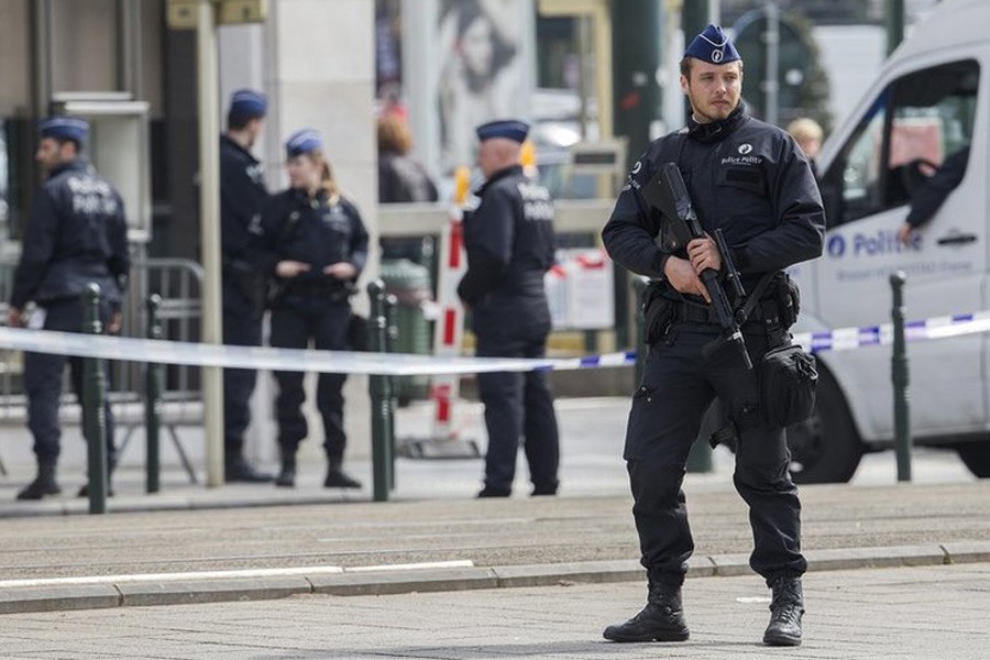 Belgian police officer secures the zone outside a courthouse while Brussels attacks suspects Mohamed Abrini and Osama Krayem appear before a judge, in Brussels. Reuters photo used for representation.
