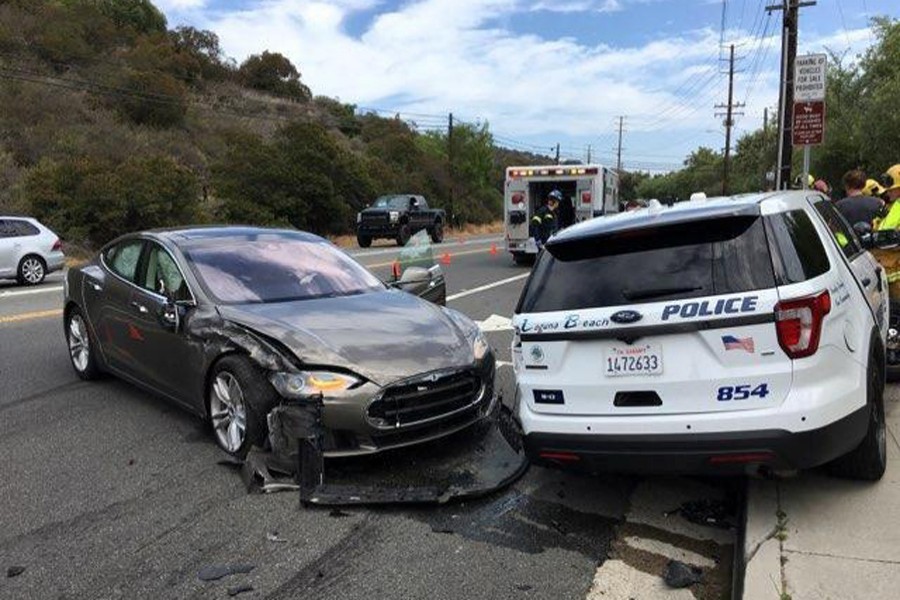 A Tesla sedan is shown after it struck a parked Laguna Beach Police Department vehicle in Laguna Beach, California, US in this May 29 handout photo. Laguna Beach Police Department/Handout via Reuters