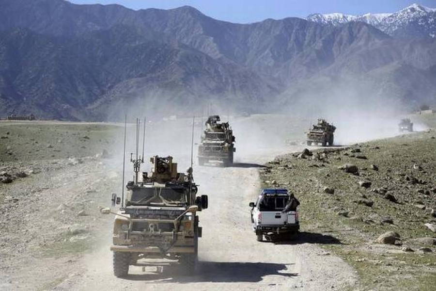 In this file photo, the US forces and the Afghan commando patrol Pandola village, as the Taliban is still either controlling or threatening almost 70% of Afghanistan.  Photo Credit: AP