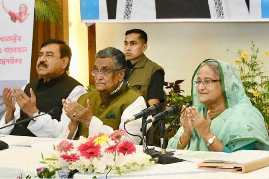 Prime Minister Sheikh Hasina offering munajat after inaugurating the second Dharla Bridge in Kurigram district through video conferencing from his official residence Ganobhaban in Dhaka on Sunday. Photo: PID