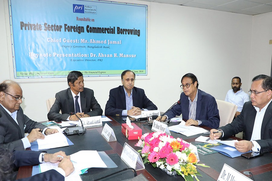 Dr Ahsan H Mansur, Executive Director, Policy Research Institute of Bangladesh (PRI), addressing a dialogue on "Private Sector Foreign Commercial Borrowing" at PRI conference room in the city on Sunday — FE photo
