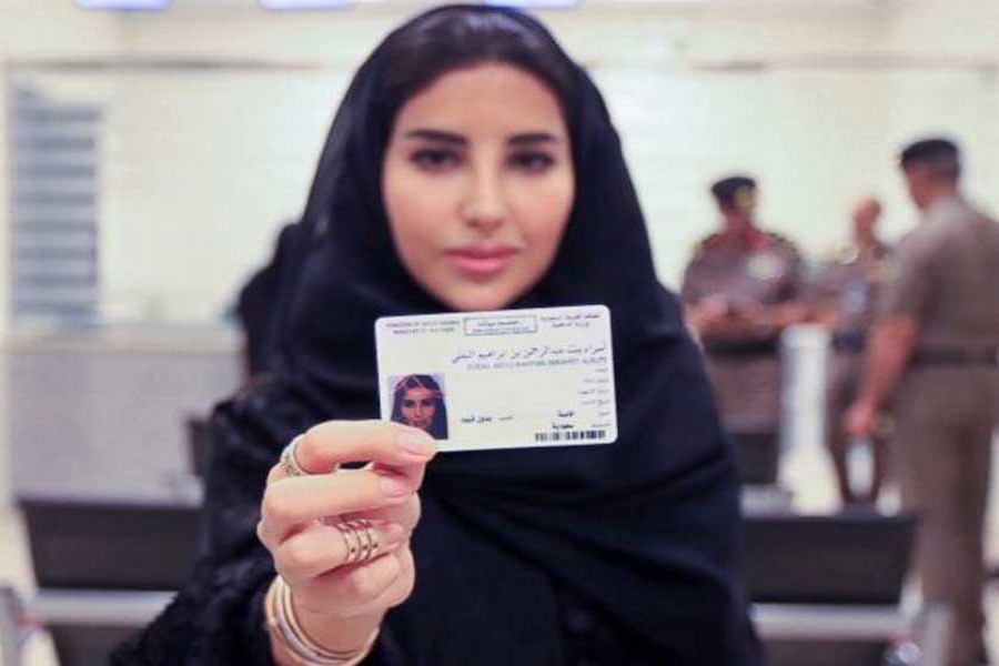 Esraa Albuti, an Executive Director at Ernst & Young, showing her brand new driving licence at the General Department of Traffic in the capital, Riyadh on Monday     -AP photo