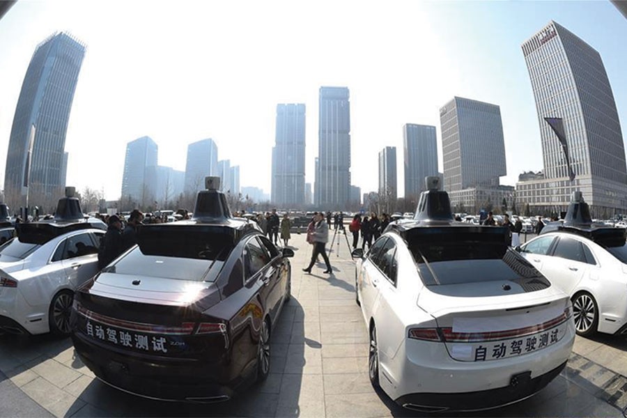 Photo taken on March 22, 2018 shows self-driving vehicles for public road testing in Beijing, capital of China. Beijing released its first temporary license plates for Baidu's self-driving vehicles for public road testing on  the  previous day.             —Photo: Xinhua