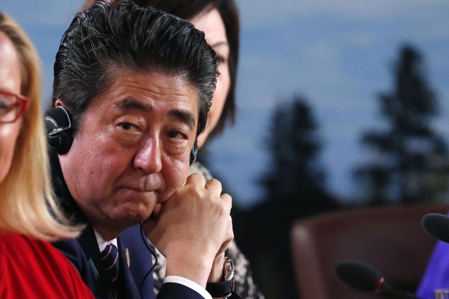 Japan's Prime Minister Shinzo Abe attends a G7 and Gender Equality Advisory Council meeting as part of a G7 summit in the Charlevoix city of La Malbaie, Quebec, Canada, June 9, 2018. Reuters