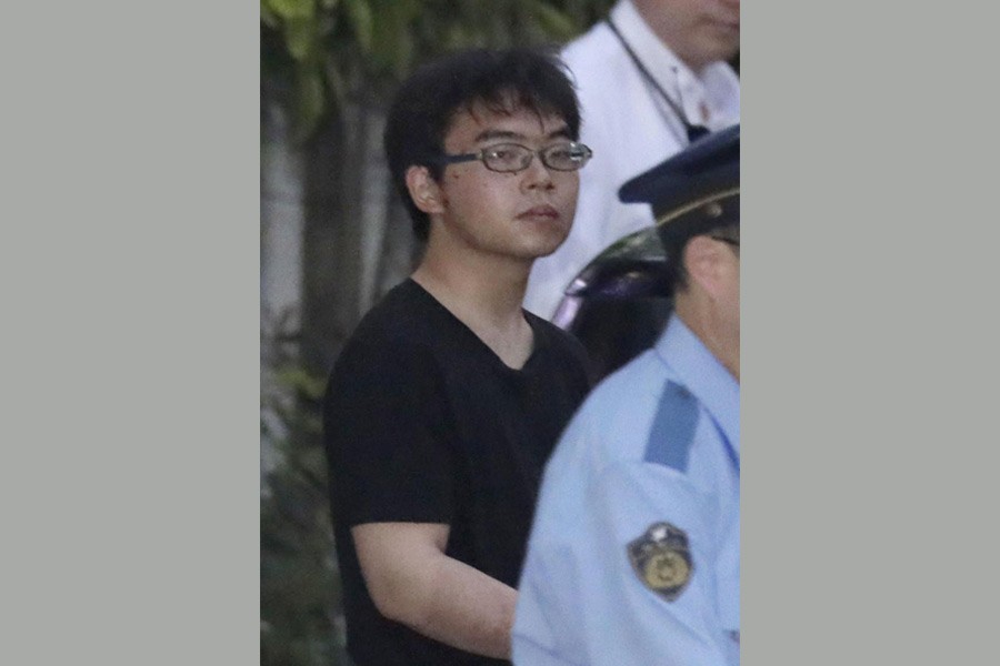 Ichiro Kojima, 22, a suspect in a stabbing incident inside a Japanese Shinkansen bullet train, leaves Odawara police station after being arrested in Odawawa, west of Tokyo, Japan, in this photo taken by Kyodo June 10, 2018. Reuters.
