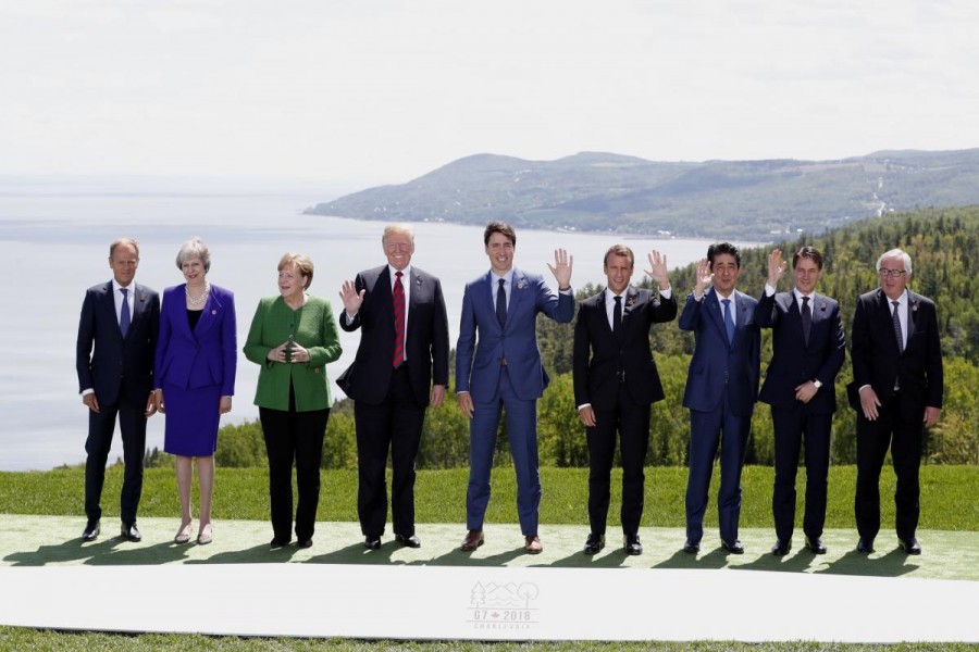 L-R: European Council President Donald Tusk, British Prime Minister Theresa May, German Chancellor Angela Merkel, US President Donald Trump, Canada's Prime Minister Justin Trudeau, French President Emmanuel Macron, Japanese Prime Minister Shinzo Abe, Italian Prime Minister Giuseppe Conte and European Commission President Jean-Claude Juncker pose for a family photo at the G7 Summit in the Charlevoix city of La Malbaie, Quebec, Canada, June 8, 2018. Reuters
