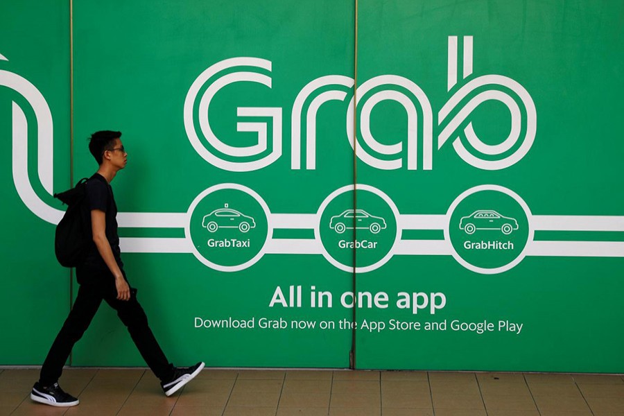 A man walks past a Grab office in Singapore on March 26 last - Reuters/File