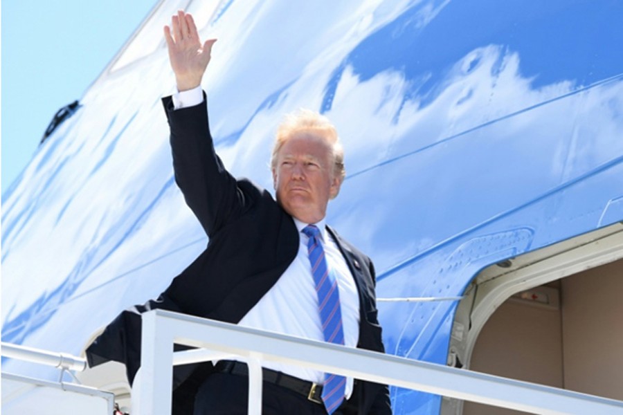 US President Donald Trump boards Air Force One to leave Canada after a contentious G7 summit on June 11. He lashed out at US allies in a Twitter rant on board the plane. 	— Photo: AFP