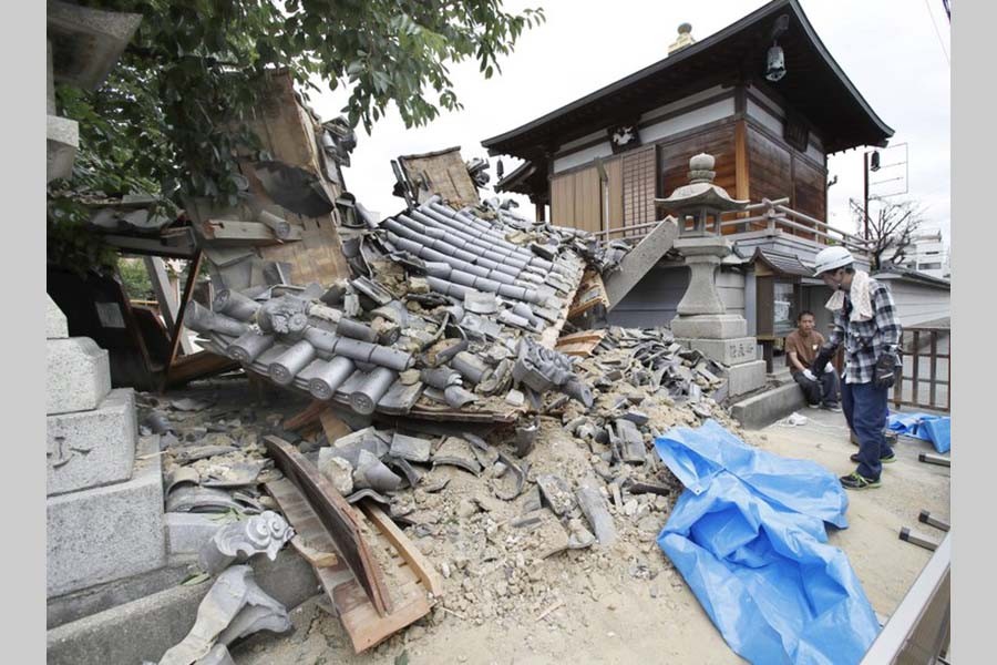 Strong quake in Japan kills three, knocks over walls