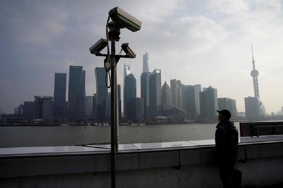 A man stands on the Bund in front of Shanghai's financial district of Pudong in Shanghai, China, February 26, 2018. Reuters/Files