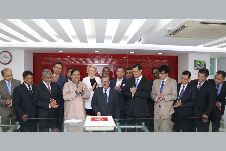 Chairman of Midland Bank Limited M Moniruzzaman Khandakar cutting a cake at a programme organised to mark the bank’s fifth anniversary at its headquarters in the capital on Wednesday