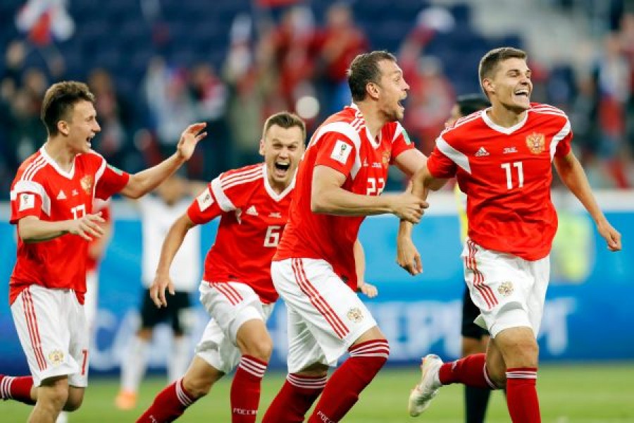 Russian players rejoice after scoring against Egypt