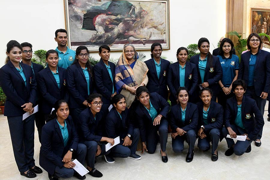 Prime Minister Sheikh Hasina posing for photograph with Bangladesh National Women Cricket team at a reception on Wednesday at Ganabhaban. -Focus Bangla Photo