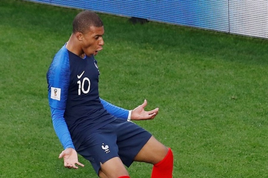 Mbappe takes France into next round