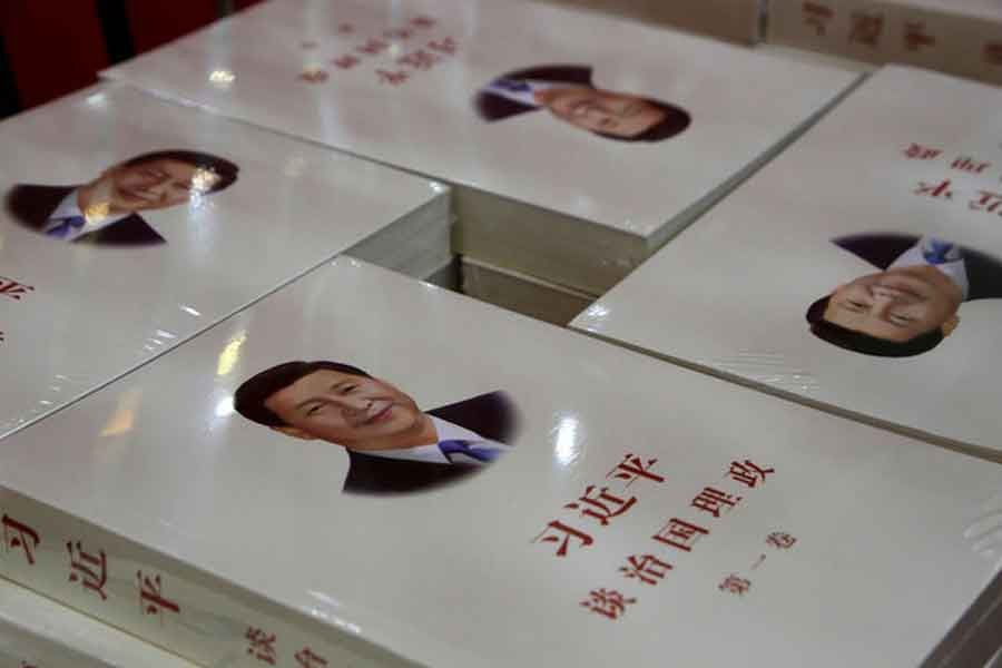 Copies of book "Xi Jinping: The governance of China" are displayed for sale at a bookstore in Beijing, China, March 1, 2018. Reuters/File Photo