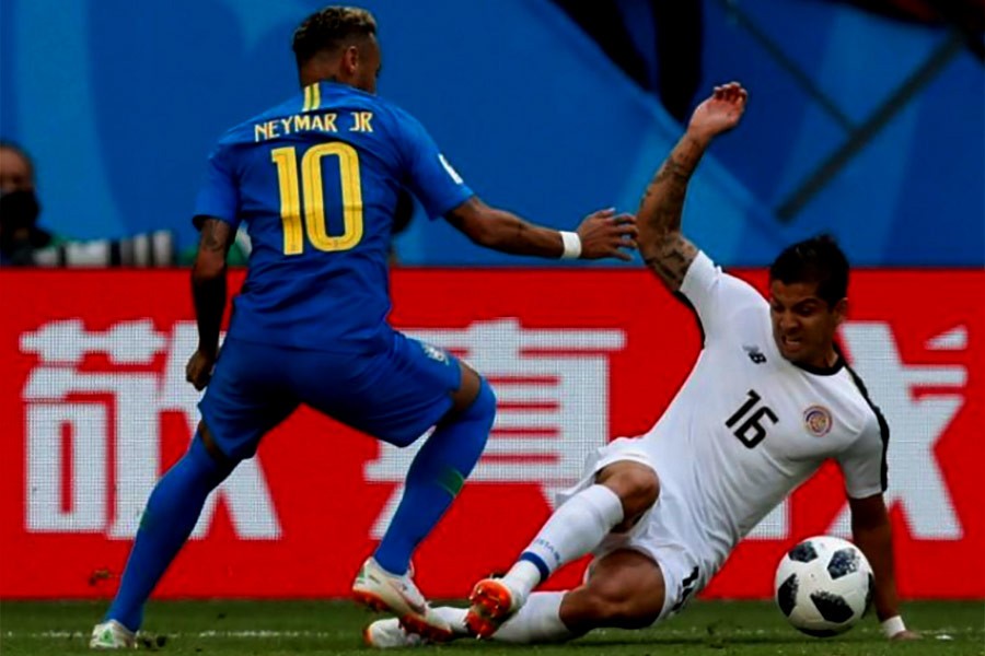 Brazil's Neymar in action with Costa Rica's Cristian Gamboa during their Group E match on Friday at Saint Petersburg Stadium in Russia. -Reuters Photo