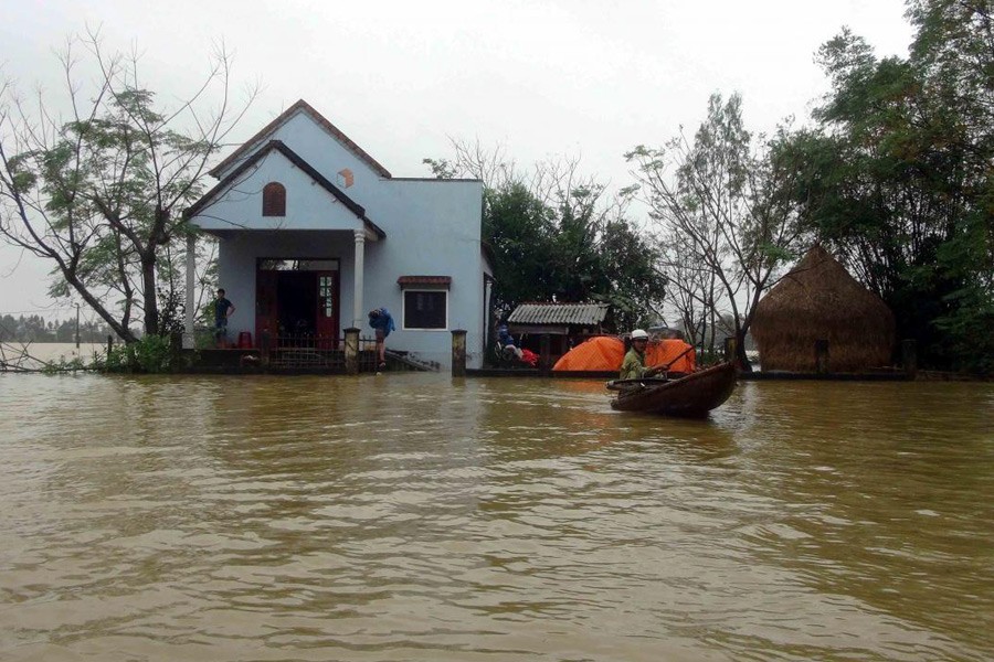 A man paddles a boat near a partially submerged house after a flood in Vietnam's central Quang Nam province, December 4, 2016. Reuters photo used for representation.