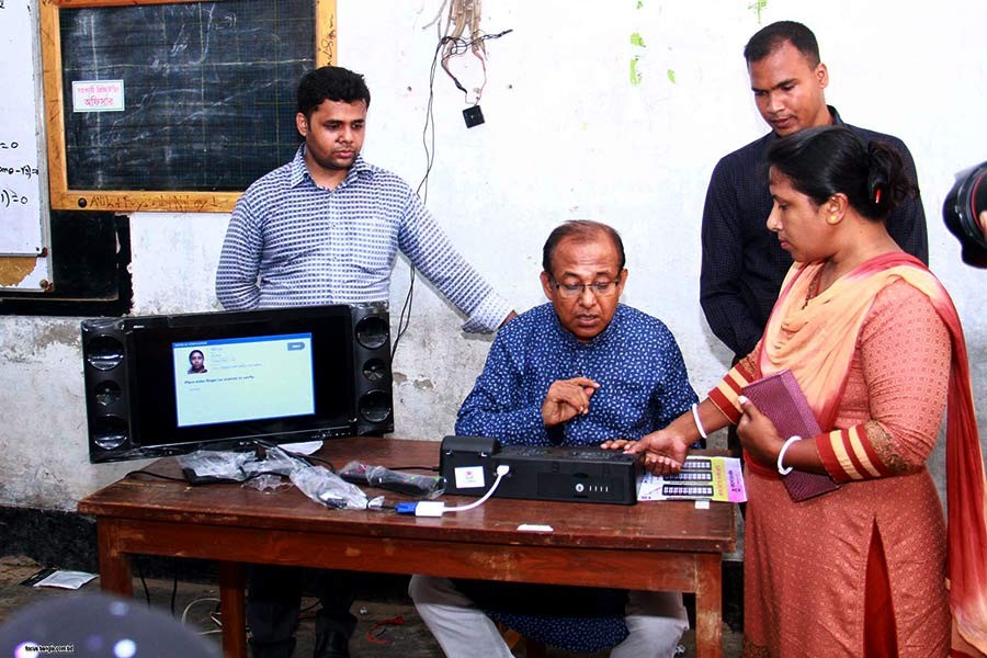 A voter casting her vote using electronic voting machine (EVM) during Gazipur City Corporation election on Tuesday. -Focus Bangla Photo