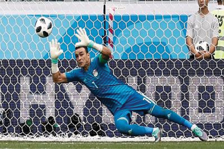 Egypt's 45 years and 161 days old goalkeeper Essam El-Hadary - who became the oldest player in FIFA World Cup history on Monday - saved a first-half penalty from Fahad Al-Muwallad of Saudi Arabia.   