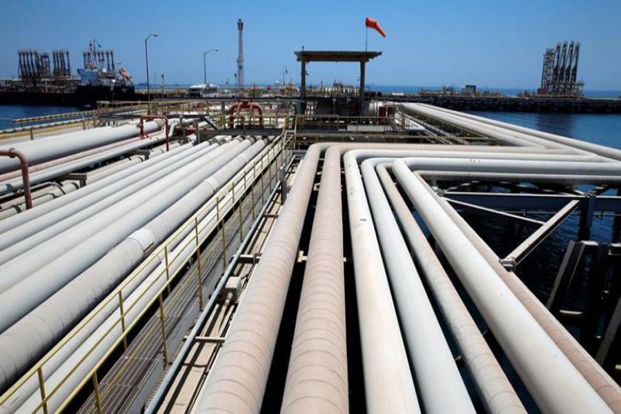 An oil tanker being loaded at Saudi Aramco's Ras Tanura oil refinery and oil terminal in Saudi Arabia 	— Reuters